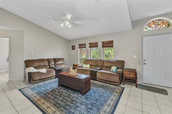 a living room with furniture and a rug
