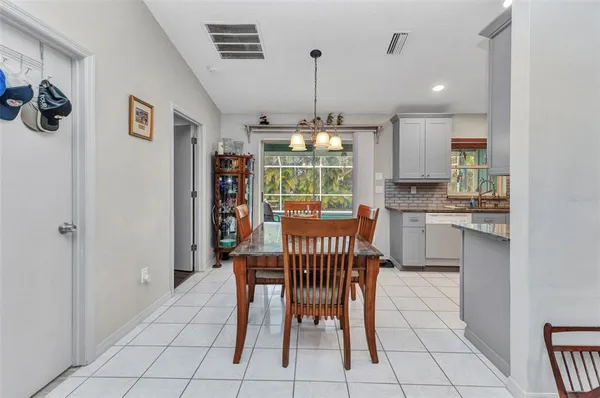 a dining room with furniture and window