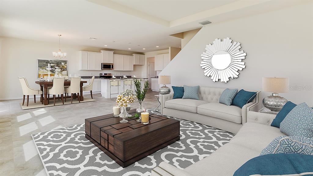 17688 Acorn Drop Road Land O Lakes, FL 34638 - Photo 6 of 15 a living room with furniture kitchen view and a table