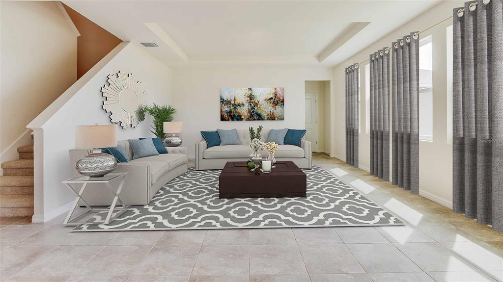 17688 Acorn Drop Road Land O Lakes, FL 34638 - Photo 7 of 15 a living room with furniture and a rug