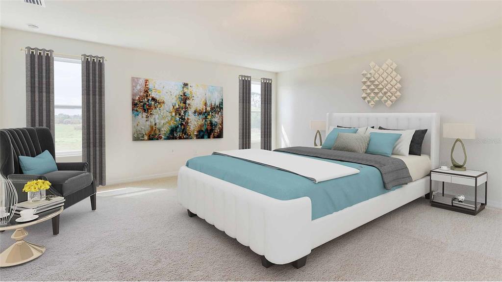 17688 Acorn Drop Road Land O Lakes, FL 34638 - Photo 10 of 15 a spacious bedroom with a bed and a couch