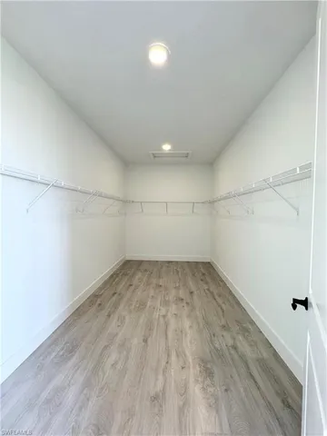 a view of an empty room and a window