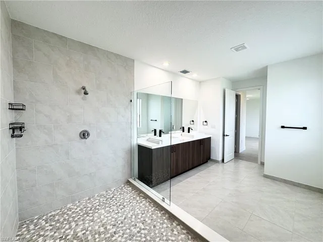 a large room with a large window and a sink