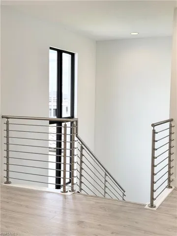 a large bathroom with a double vanity sink a mirror and a shower