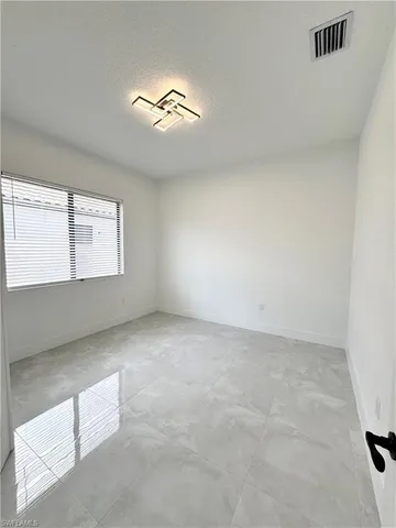 a view of an empty room with window