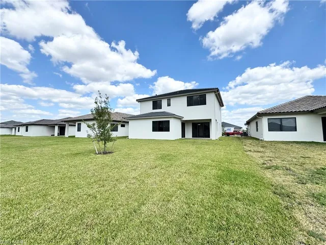a house that has a large window in front of it
