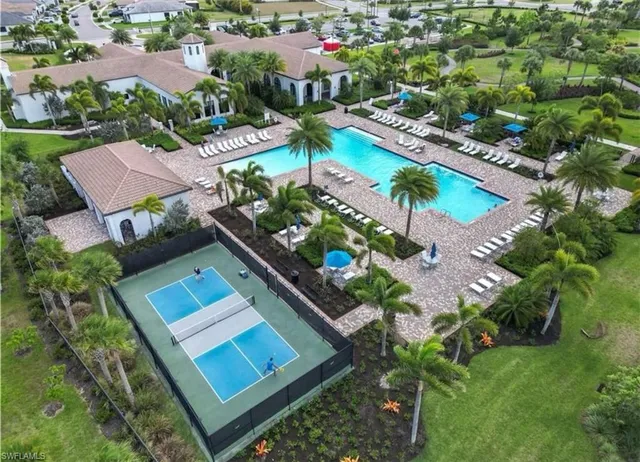 an aerial view of residential house with outdoor space and swimming pool