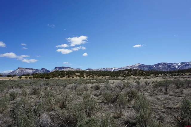 a view of lake and mountains