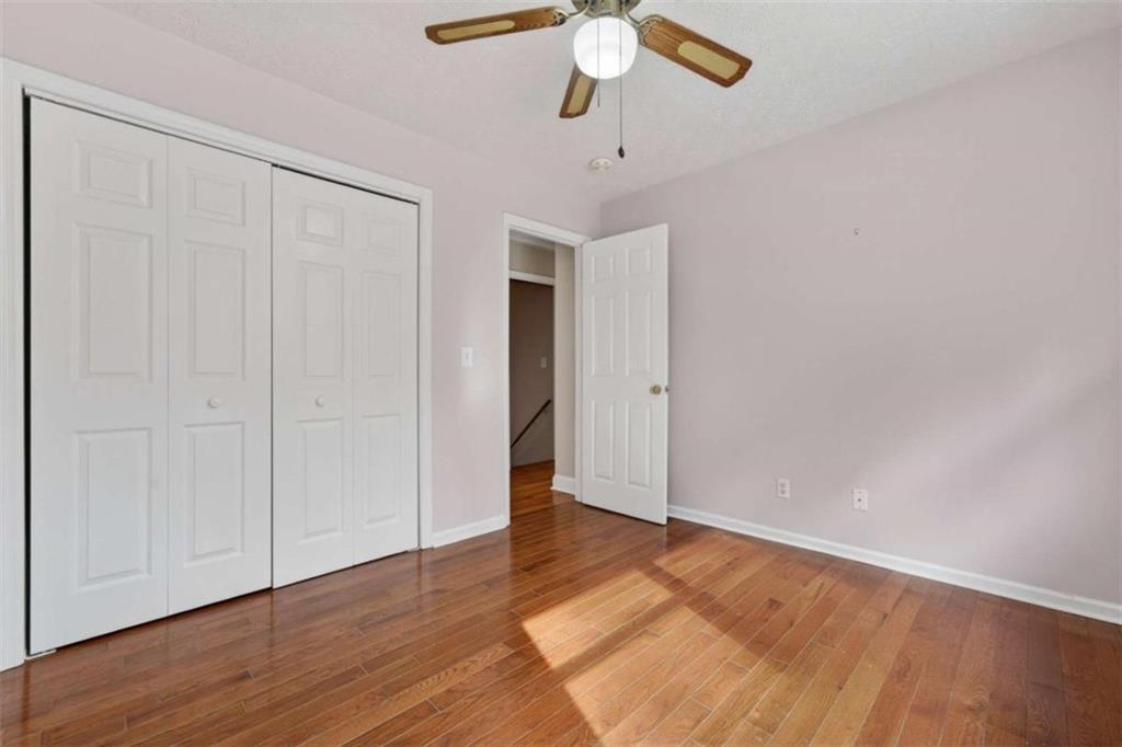 1951 Swords Trail Buckhead, GA 30625 - Photo 30 of 102 an empty room with wooden floor closet and windows