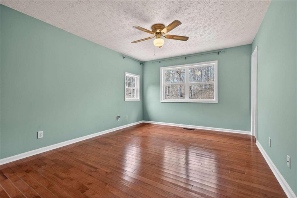 1951 Swords Trail Buckhead, GA 30625 - Photo 36 of 102 a view of a big room with wooden floor and a window