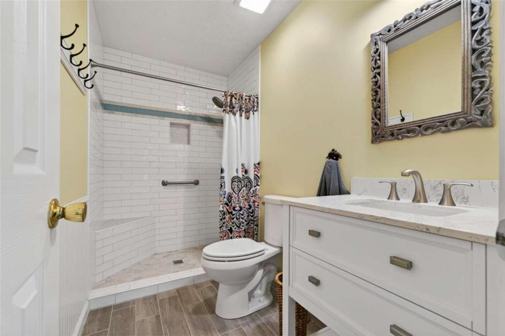 1951 Swords Trail Buckhead, GA 30625 - Photo 38 of 102 a bathroom with a sink a toilet and shower