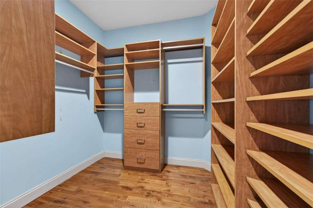 1951 Swords Trail Buckhead, GA 30625 - Photo 47 of 102 a view of walk in closet with clothes