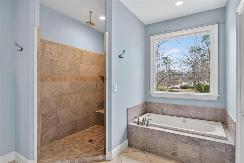 1951 Swords Trail Buckhead, GA 30625 - Photo 50 of 102 a bathroom with a tub a toilet and a shower