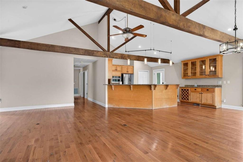 1951 Swords Trail Buckhead, GA 30625 - Photo 59 of 102 a view of a livingroom with wooden floor and a ceiling fan