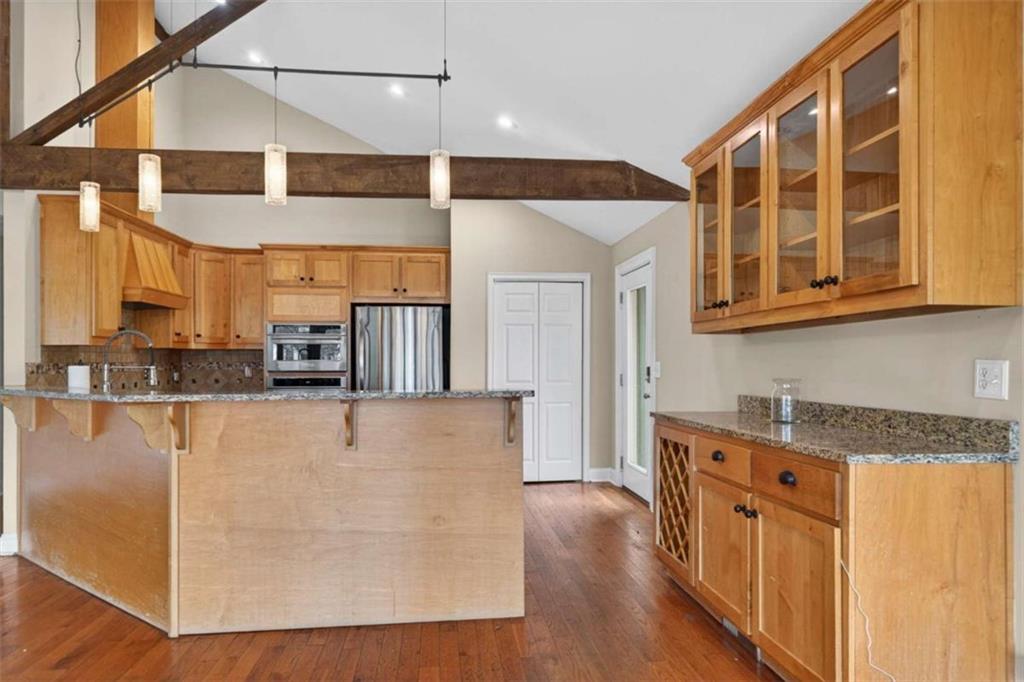 1951 Swords Trail Buckhead, GA 30625 - Photo 67 of 102 a view of a kitchen with stainless steel appliances granite countertop a refrigerator a stove and a wooden floors