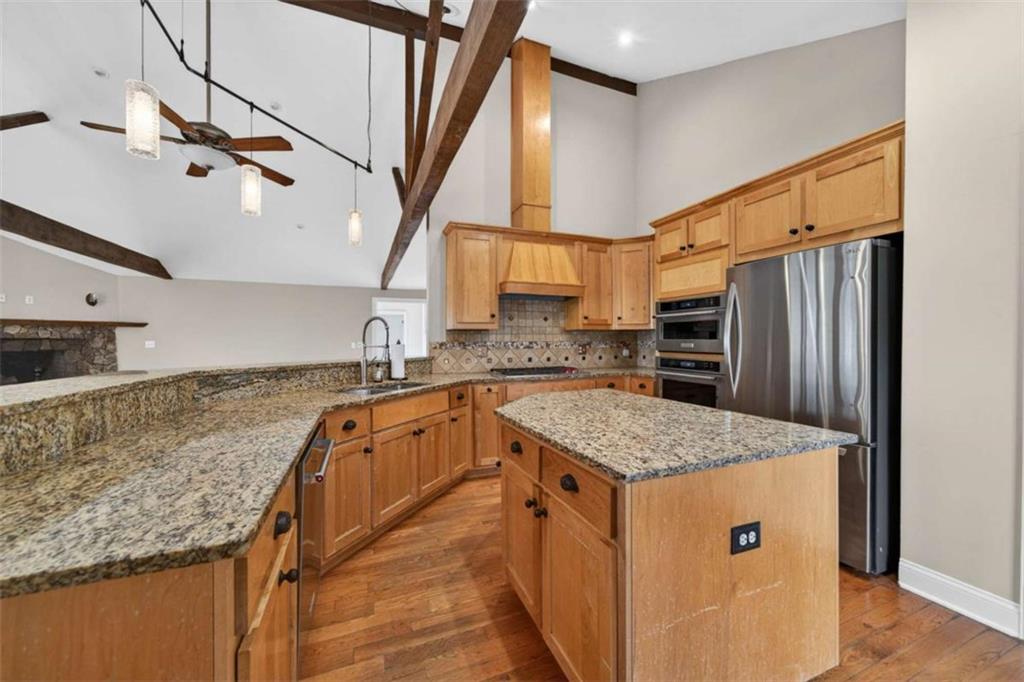 1951 Swords Trail Buckhead, GA 30625 - Photo 71 of 102 a kitchen with stainless steel appliances granite countertop a sink and a refrigerator