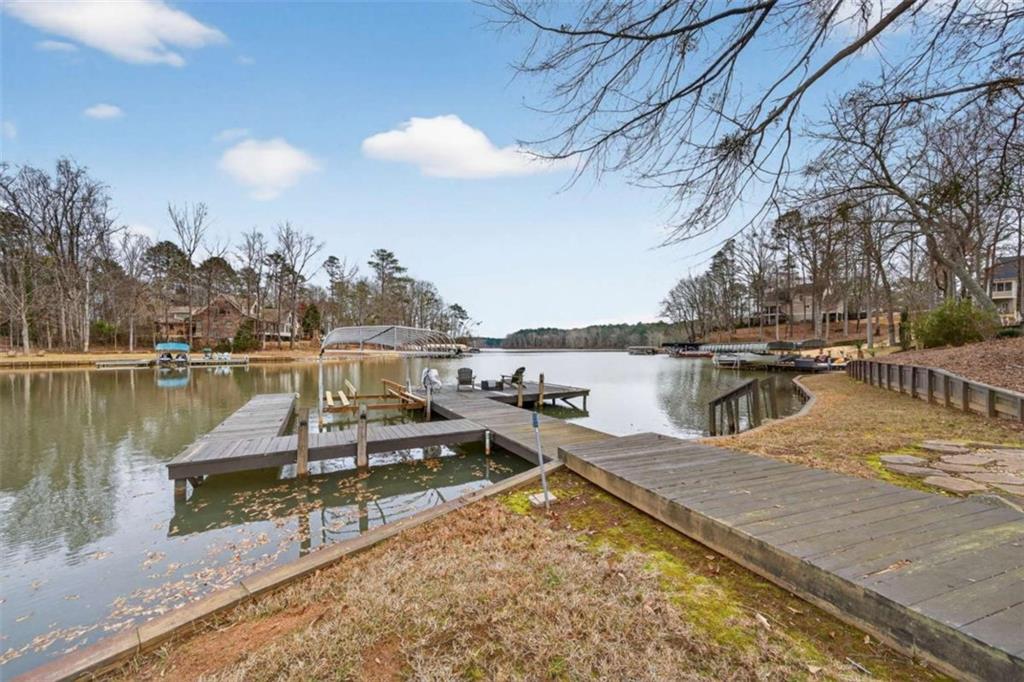 1951 Swords Trail Buckhead, GA 30625 - Photo 8 of 102 a view of a lake with boats and trees in the background