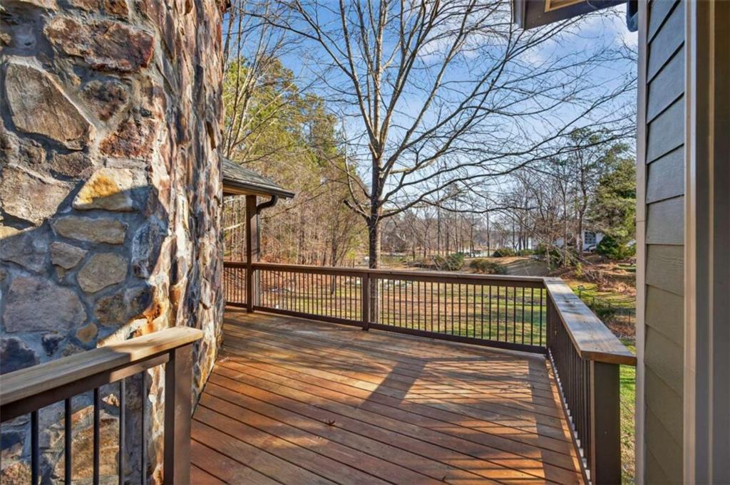 1951 Swords Trail Buckhead, GA 30625 - Photo 83 of 102 a view of a balcony with wooden floor and fence and a bench