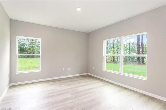 an empty room with windows