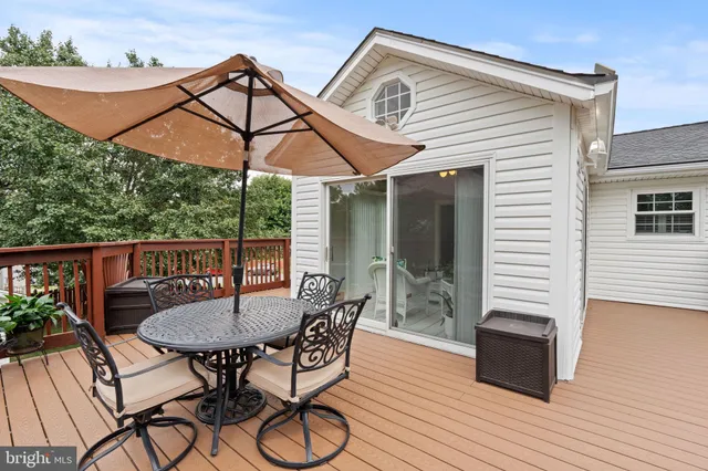 a balcony view with a seating space
