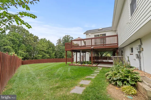 a view of a house with a yard porch and sitting area