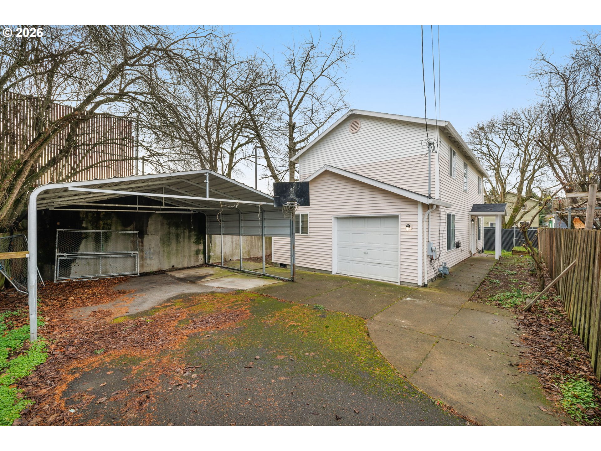 8704 Southeast Rhone Street Portland, OR 97266 - Photo 1 of 24 a view of a house with a yard and garage