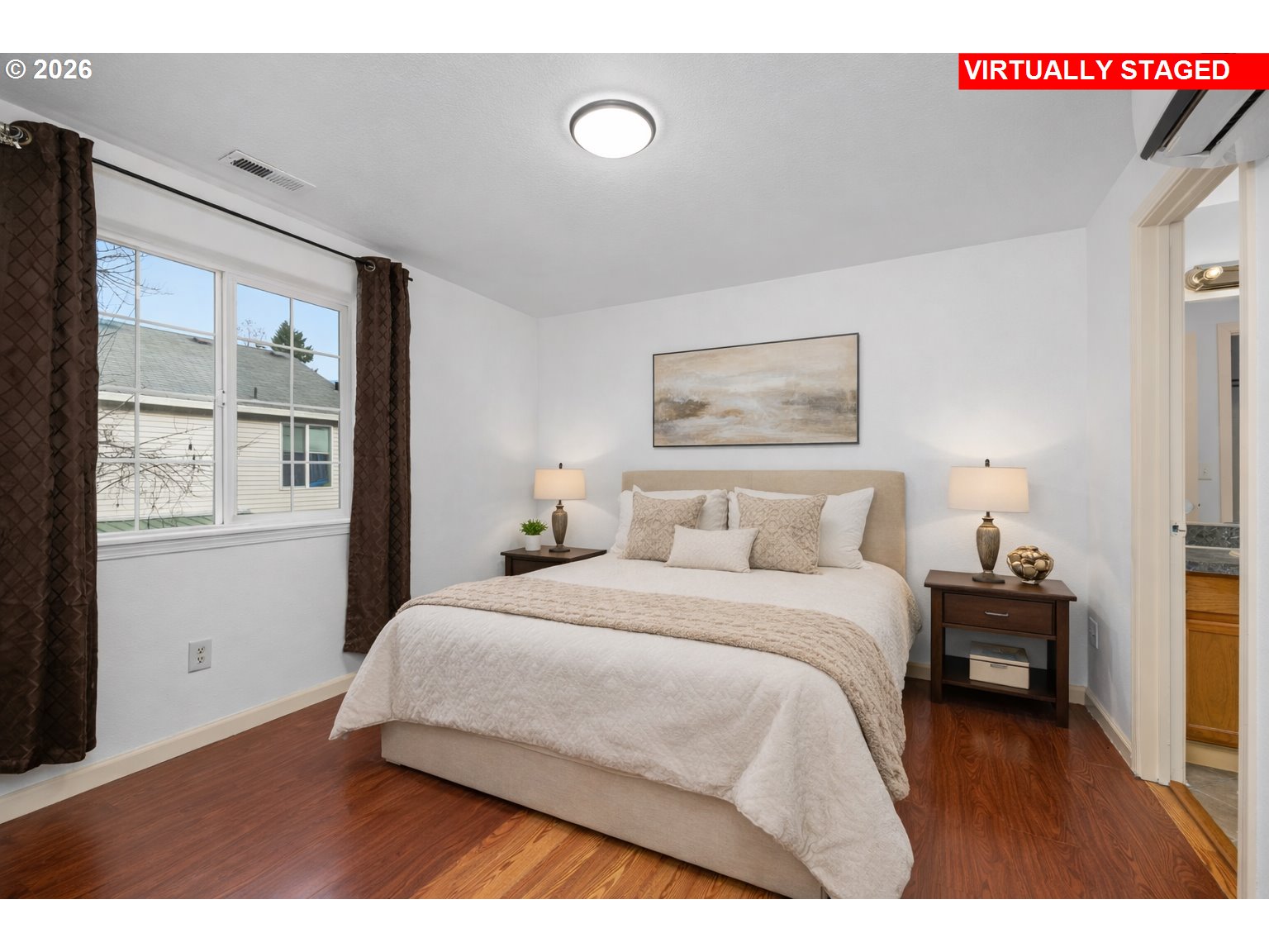 8704 Southeast Rhone Street Portland, OR 97266 - Photo 13 of 24 a bedroom with a bed and a large window