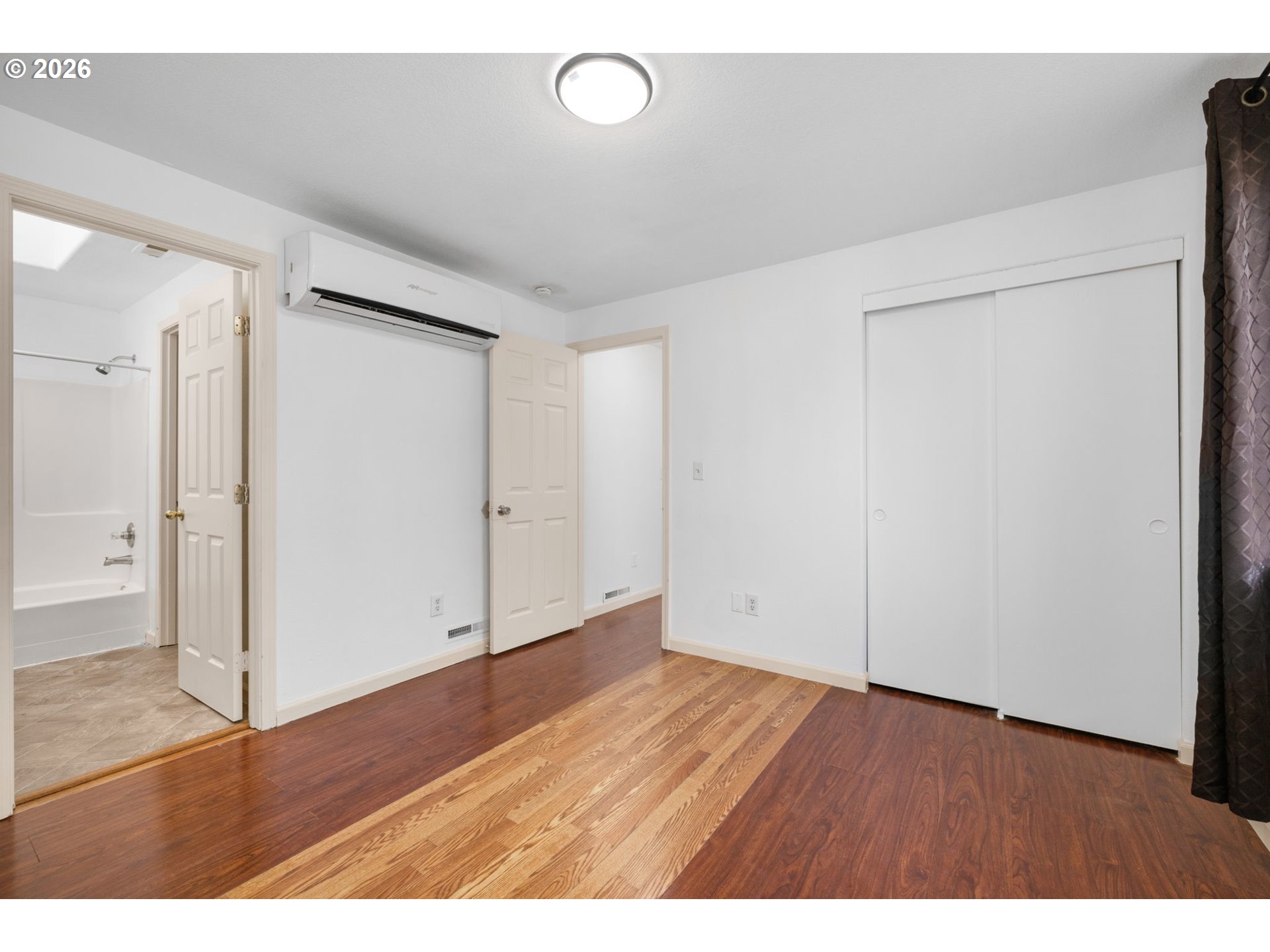 8704 Southeast Rhone Street Portland, OR 97266 - Photo 14 of 24 an empty room with wooden floor