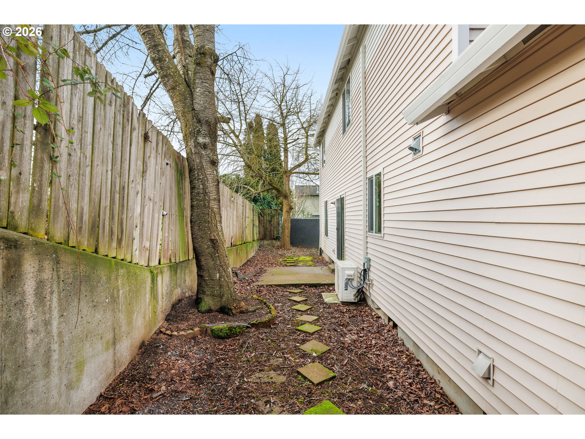 8704 Southeast Rhone Street Portland, OR 97266 - Photo 23 of 24 a view of a backyard with pathway