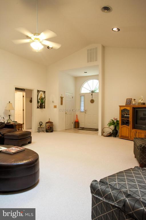 133 Pinehurst Road Berlin, MD 21811 - Photo 12 of 112 a living room with furniture and a chandelier