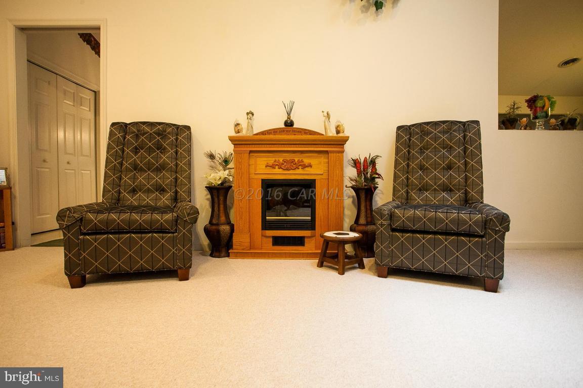 133 Pinehurst Road Berlin, MD 21811 - Photo 16 of 112 a living room with furniture and a fireplace