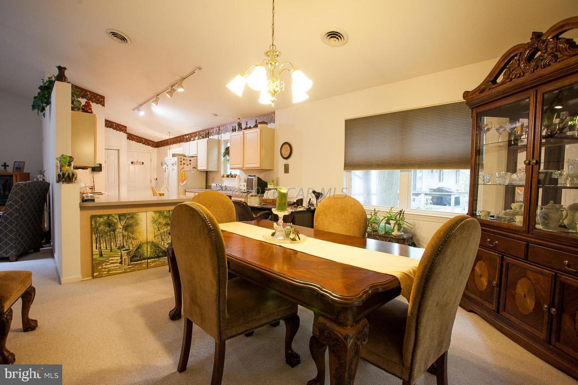 133 Pinehurst Road Berlin, MD 21811 - Photo 28 of 112 a view of a dining room with furniture
