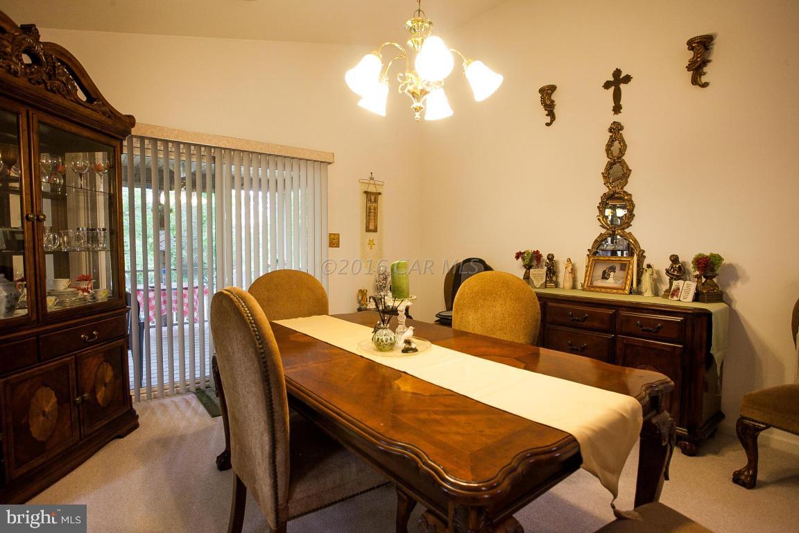 133 Pinehurst Road Berlin, MD 21811 - Photo 30 of 112 a view of a dining room with furniture and wooden floor