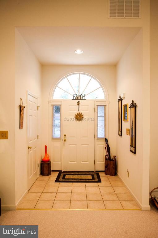 133 Pinehurst Road Berlin, MD 21811 - Photo 4 of 112 a view of a hallway with wooden floor and a living room