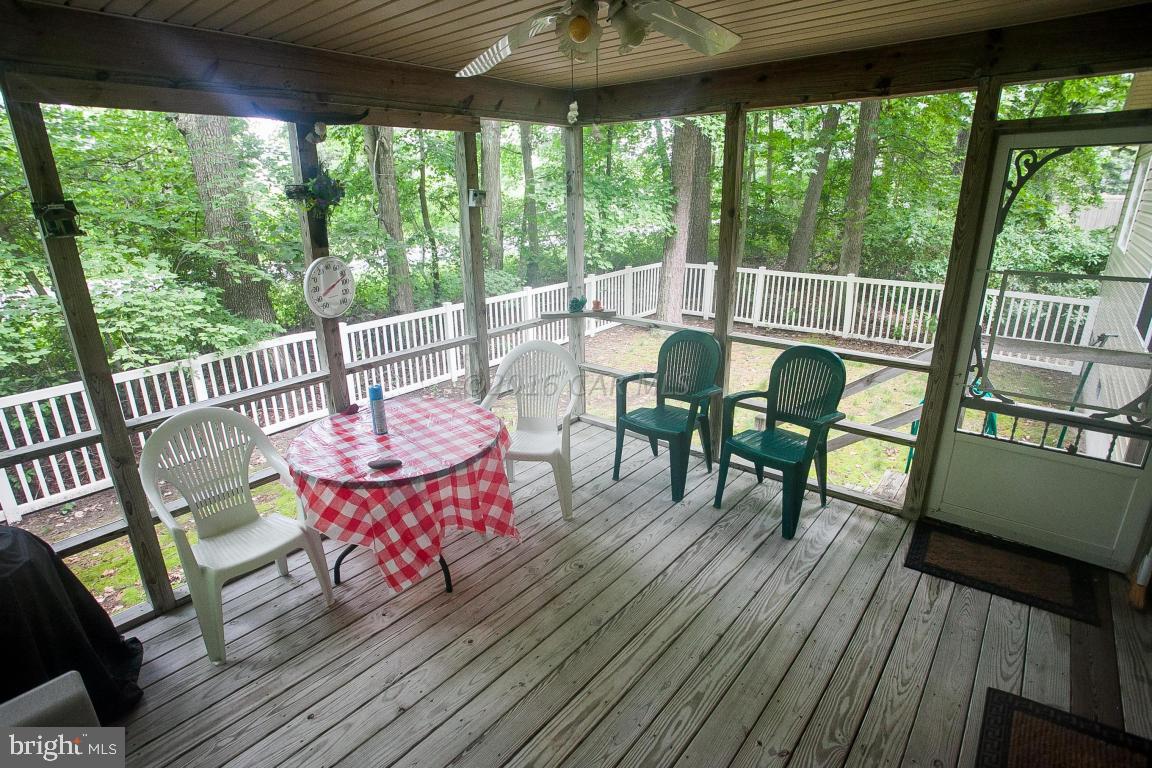 133 Pinehurst Road Berlin, MD 21811 - Photo 32 of 112 a view of a dining room with furniture and wooden floor