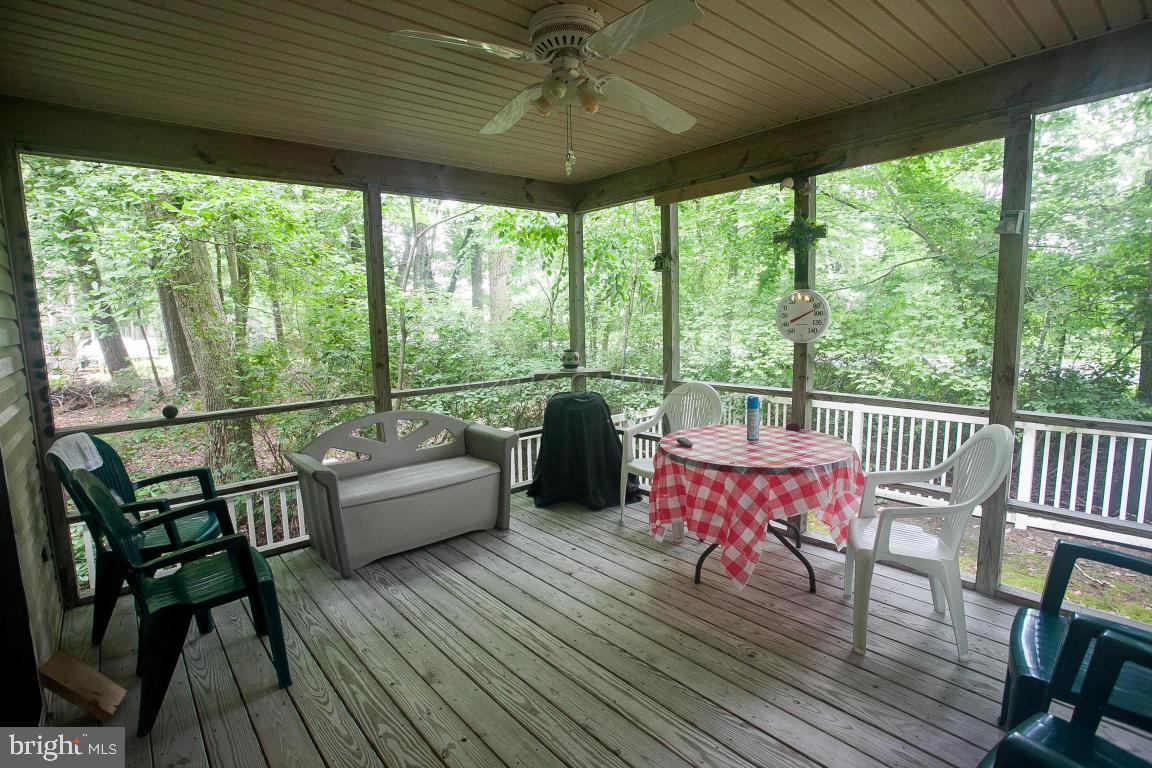 133 Pinehurst Road Berlin, MD 21811 - Photo 37 of 112 a view of a porch with furniture and wooden floor