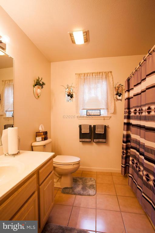 133 Pinehurst Road Berlin, MD 21811 - Photo 46 of 112 a bathroom with a sink a toilet and shower