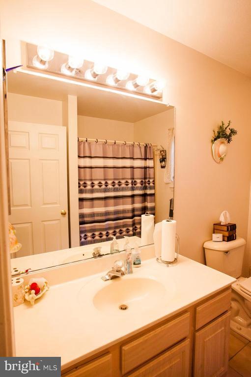 133 Pinehurst Road Berlin, MD 21811 - Photo 47 of 112 a bathroom with a sink and a mirror