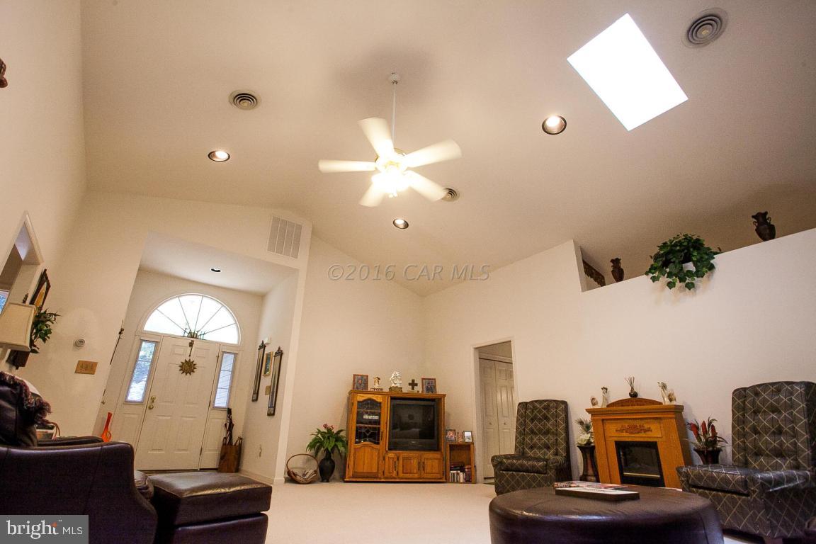 133 Pinehurst Road Berlin, MD 21811 - Photo 7 of 112 a living room with furniture and a chandelier