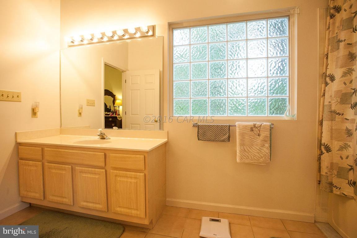 133 Pinehurst Road Berlin, MD 21811 - Photo 74 of 112 a bathroom with a sink and a mirror