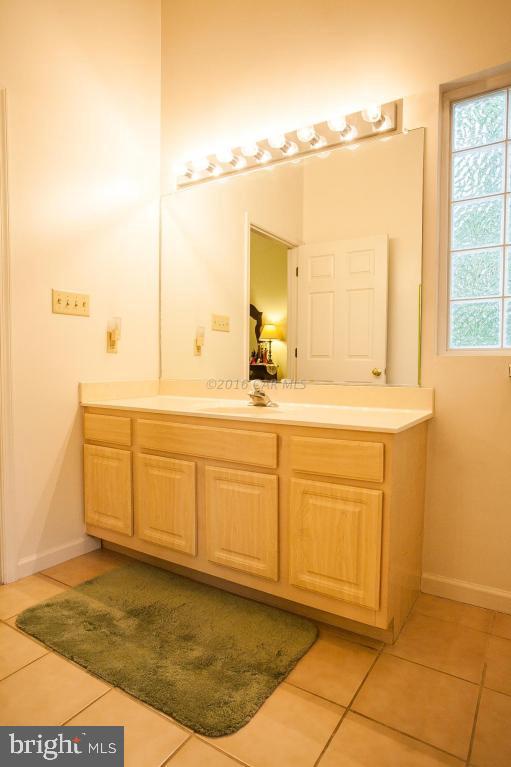 133 Pinehurst Road Berlin, MD 21811 - Photo 75 of 112 a bathroom with a sink vanity and mirror