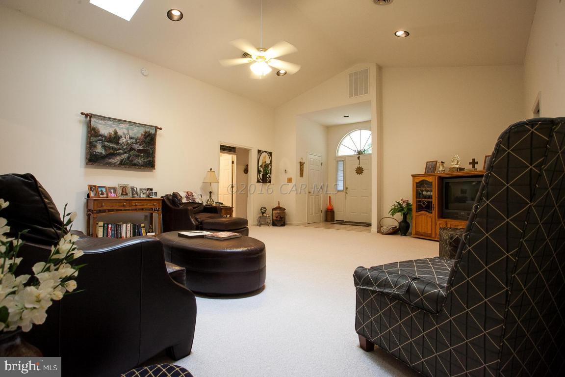 133 Pinehurst Road Berlin, MD 21811 - Photo 10 of 112 a living room with furniture a flat screen tv and a fireplace