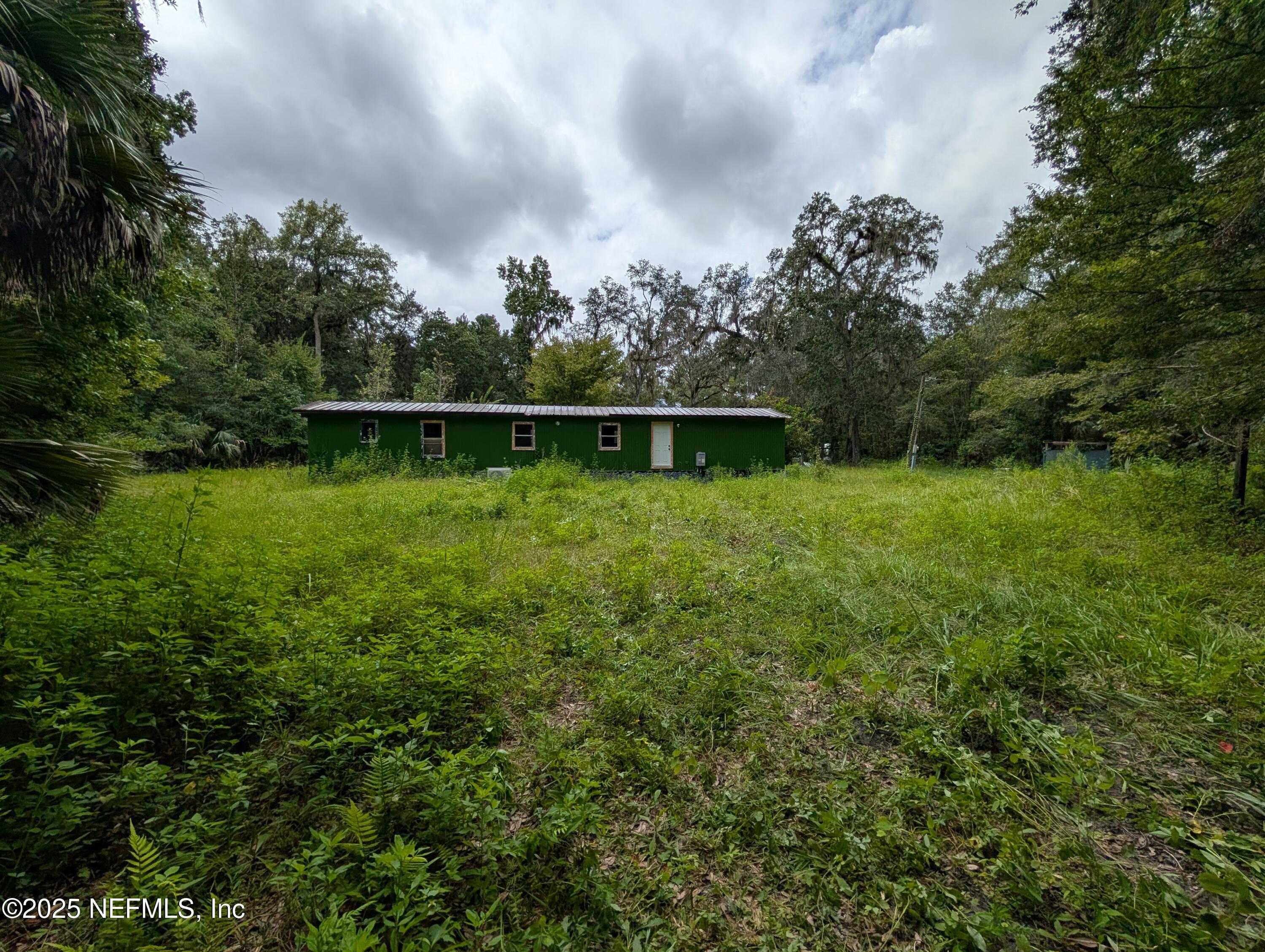 147 Pinetree Road Palatka, FL 32177 - Photo 15 of 17 a view of a lake with a large trees