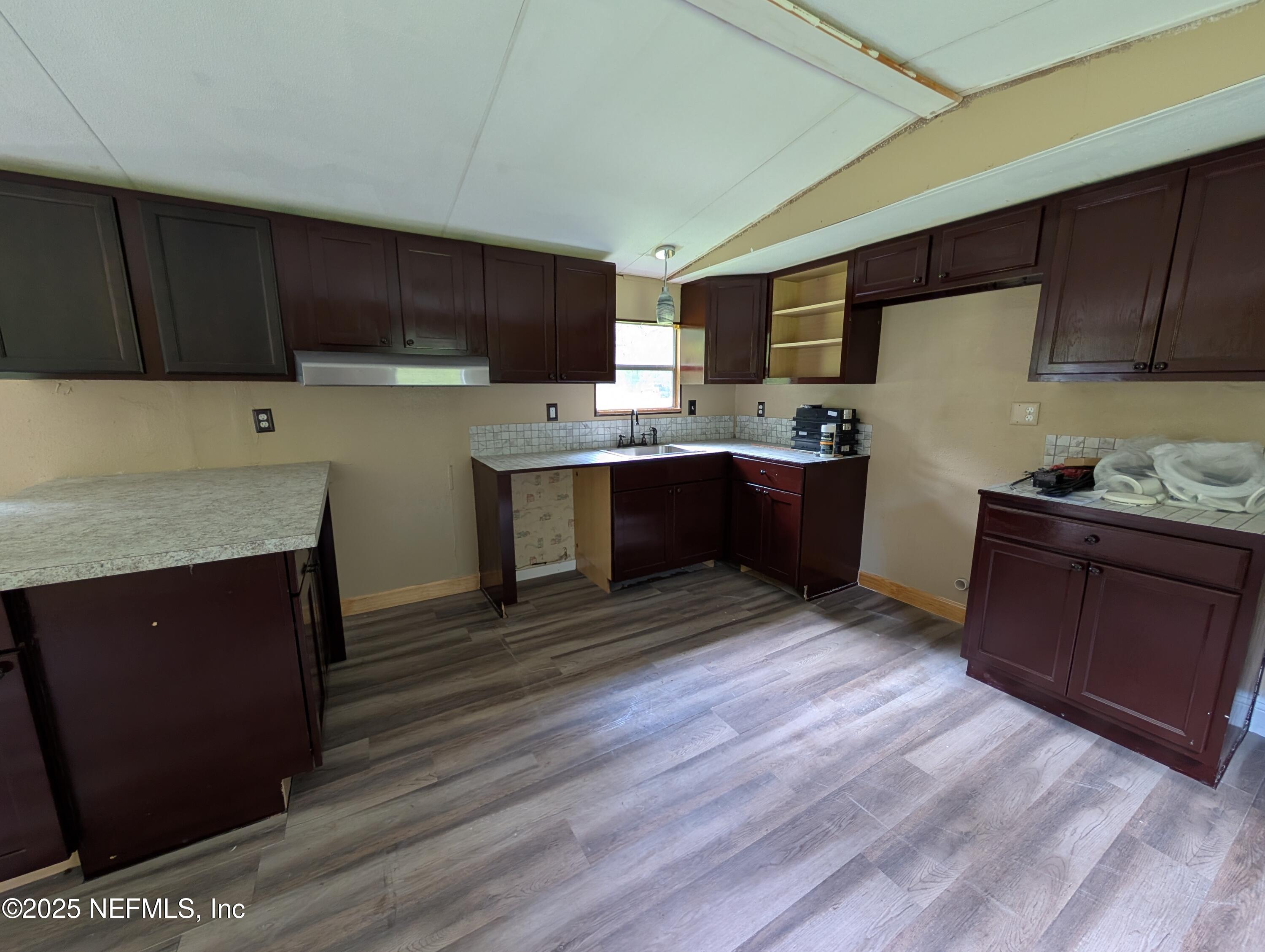 147 Pinetree Road Palatka, FL 32177 - Photo 5 of 17 a kitchen with stainless steel appliances granite countertop a stove a refrigerator a sink dishwasher and a microwave oven with cabinets