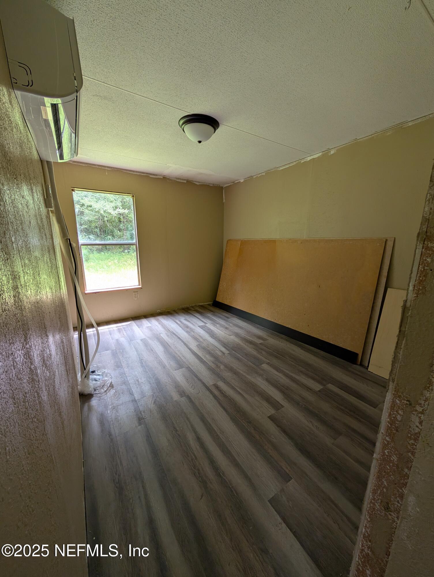 147 Pinetree Road Palatka, FL 32177 - Photo 9 of 17 wooden floor in an empty room