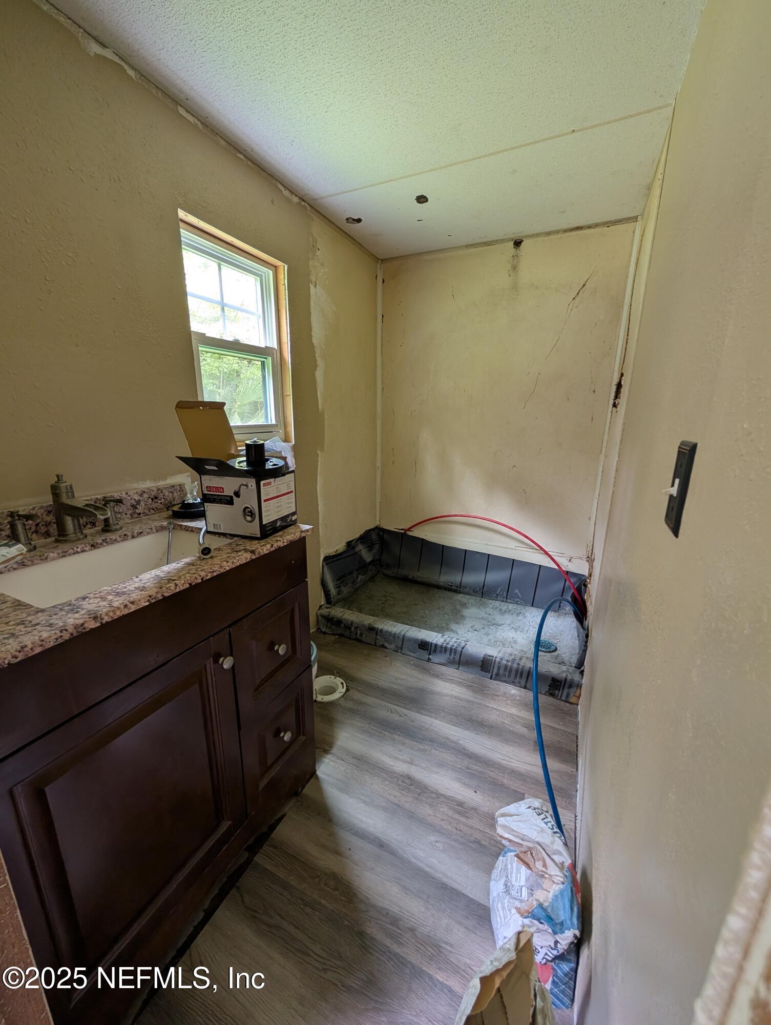 147 Pinetree Road Palatka, FL 32177 - Photo 10 of 17 a bathroom with a sink mirror vanity and toilet