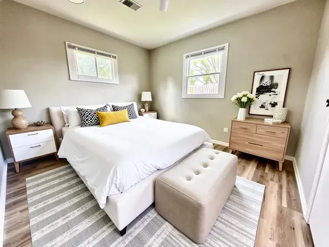 a bedroom with a bed and a couch