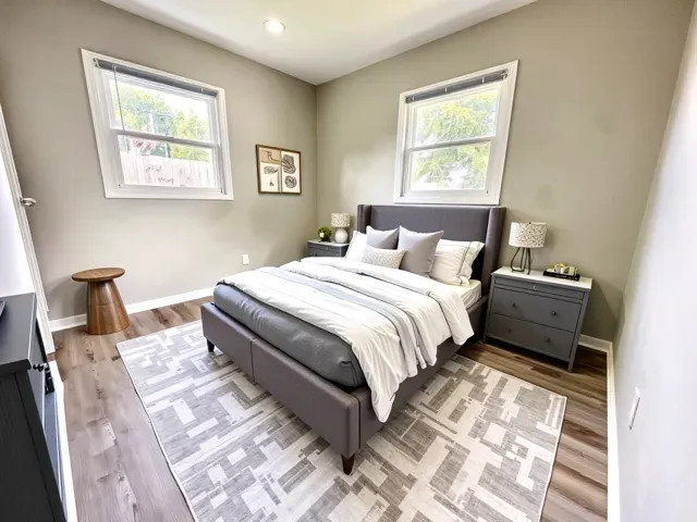 a bedroom with a bed and a window