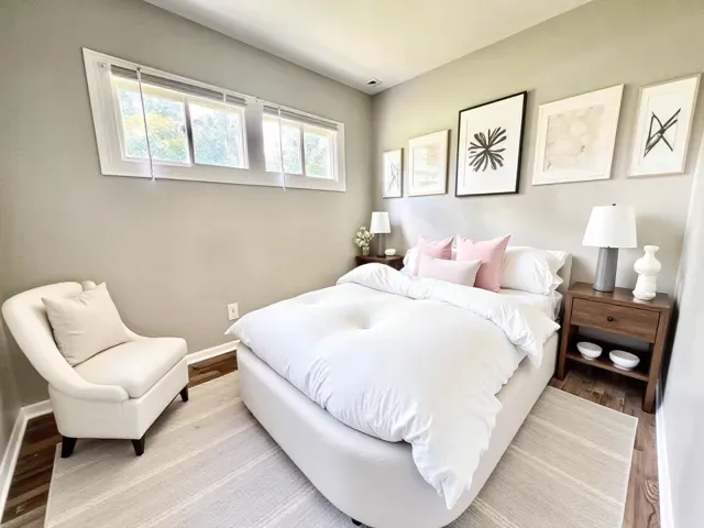 a bedroom with a bed and chair