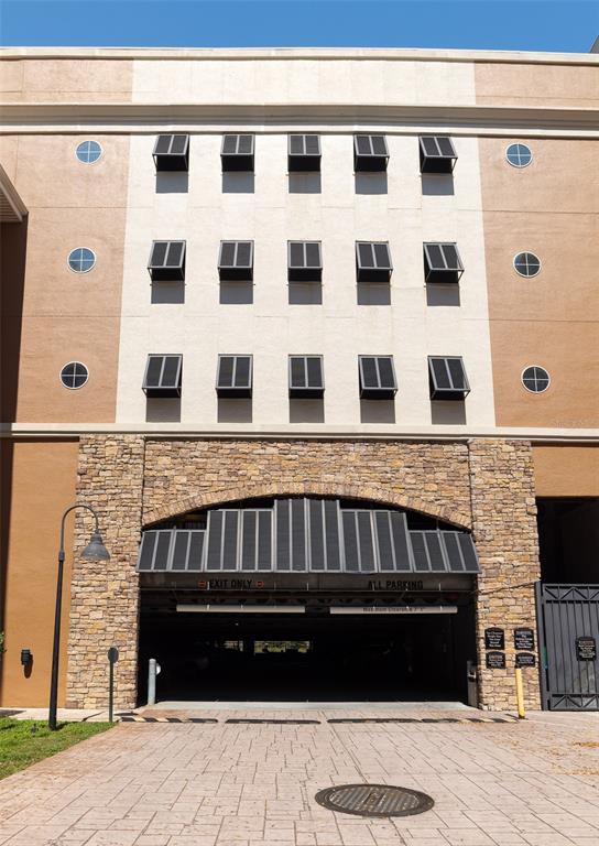 a view of a brick building with many windows